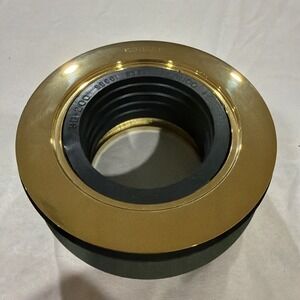 Kohler K-9132 round shower drain with a gasket in a polished brass finish.